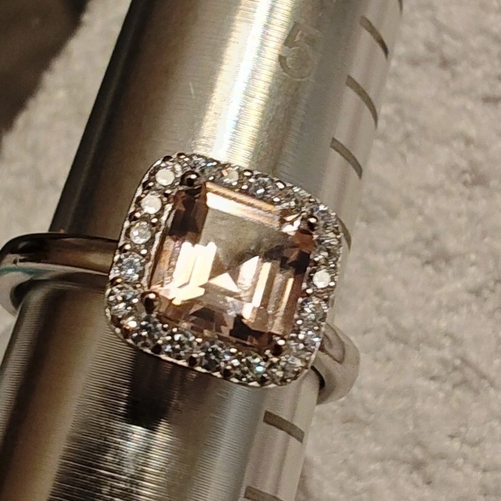 Elegant silver ring features a stunning cushion-cut pink morganite